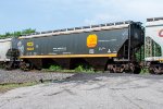 A relatively clean KCS hoppers rolls north through Howe, OK
